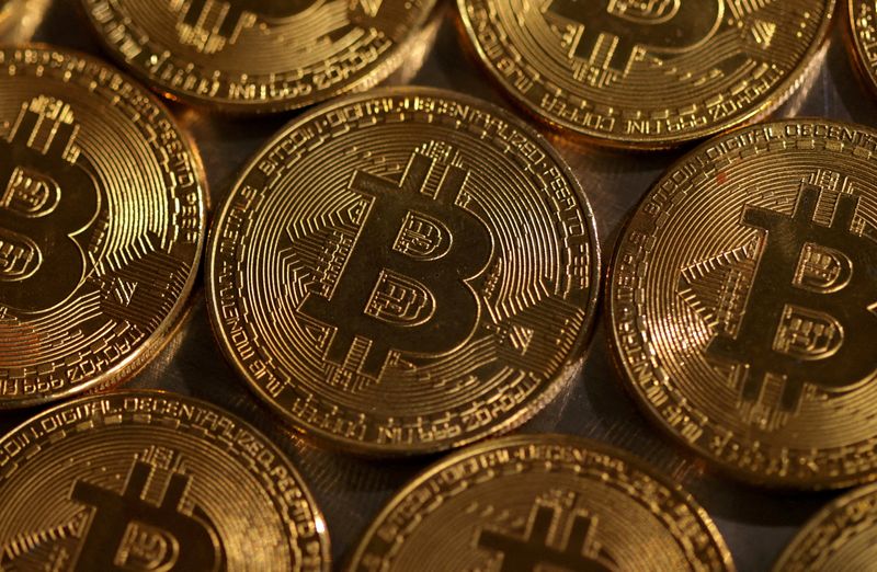 Bitcoin soars to record high, then tumbles